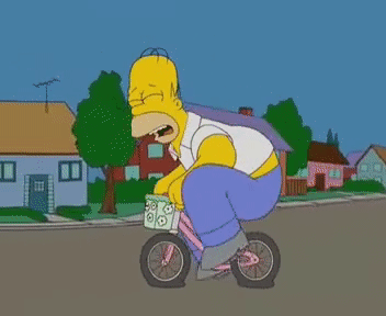 Homer Simpson andando de bicicleta com pneus furados